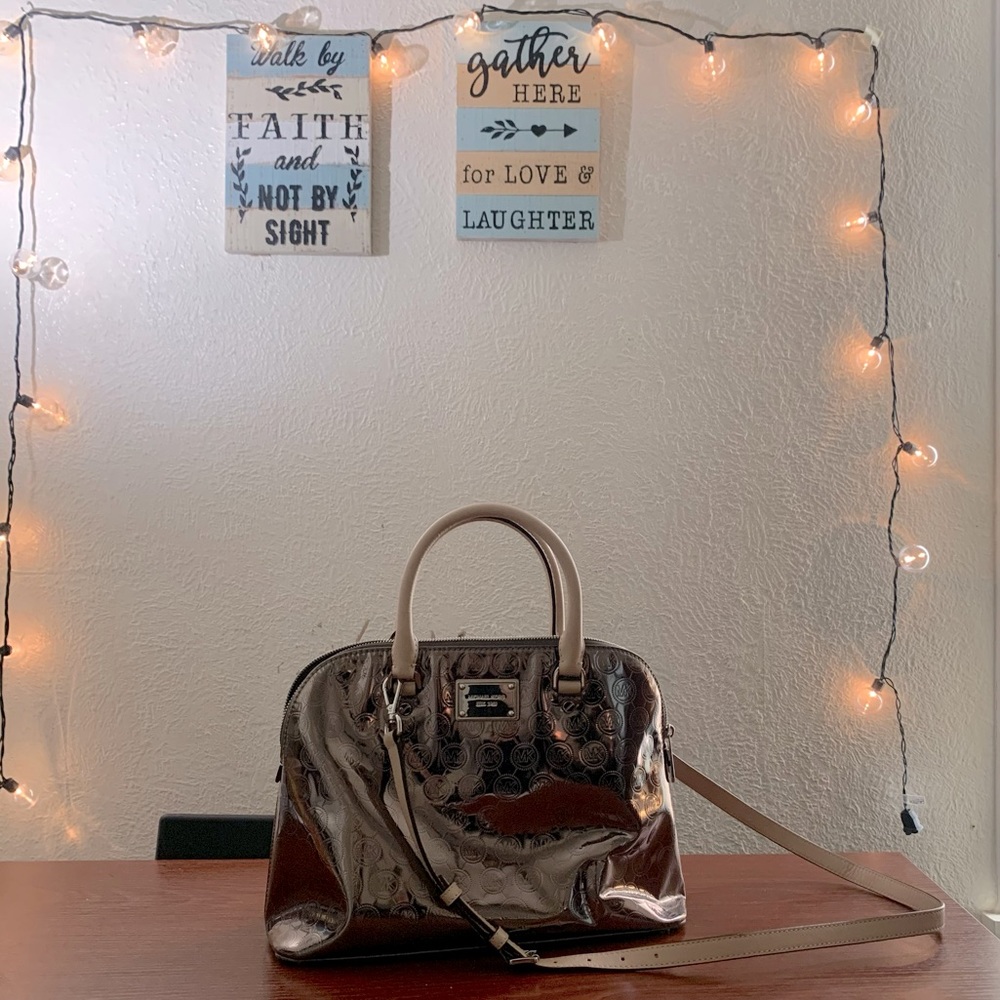 Absolutely gorgeous chrome style MK bag.